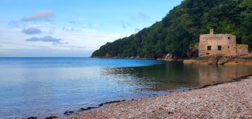 Ruins of a building next to a body of water