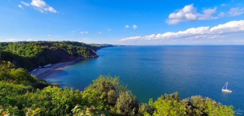 view of beach and sea with a boat