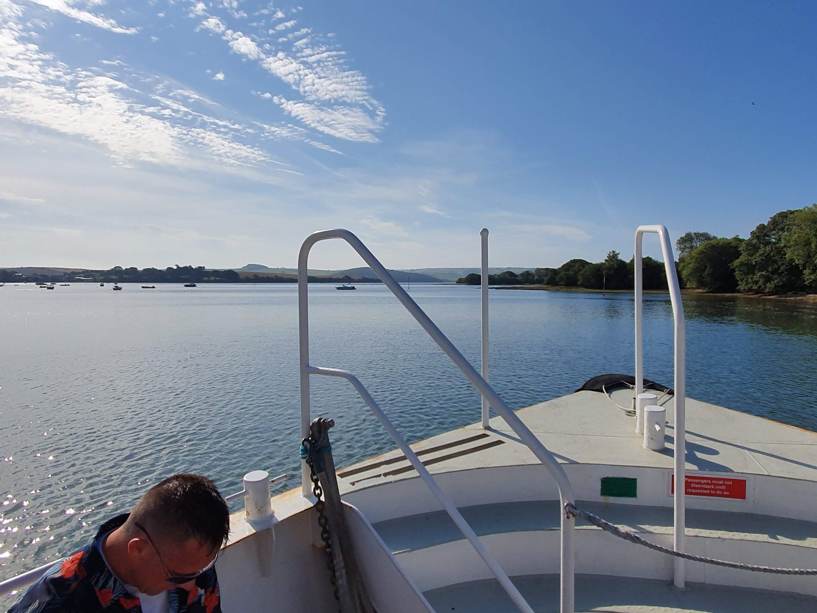 on a boat heading down river