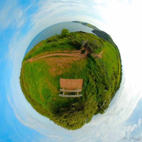 View looking over sea from a bench