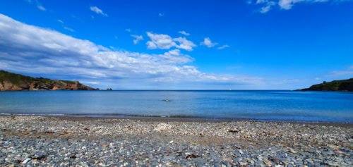 Brixham beach with blue sky