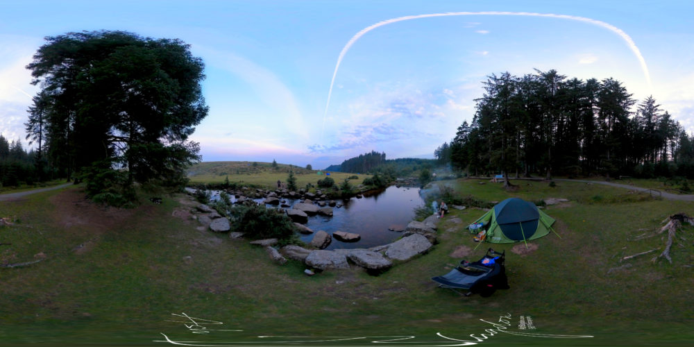 Tent set up next to river
