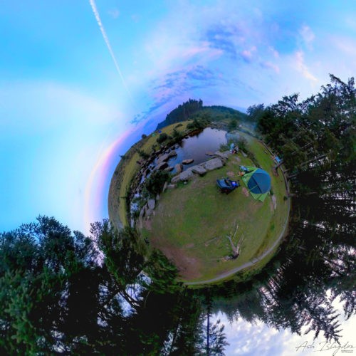 Tent set up next to river