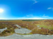 Overlooking moorland, forest and Blue skies