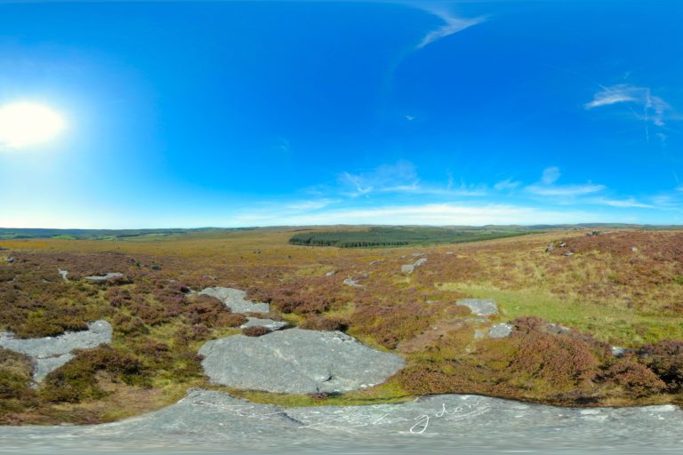 Overlooking moorland, forest and Blue skies