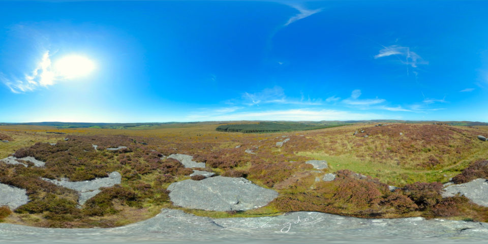 Overlooking moorland, forest and Blue skies