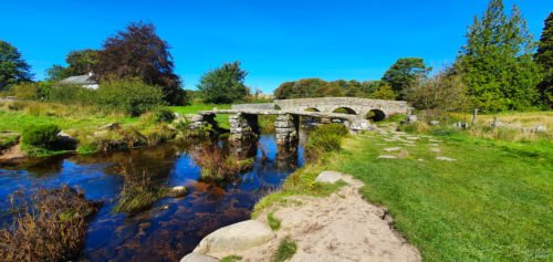 a medieval bridge over a river